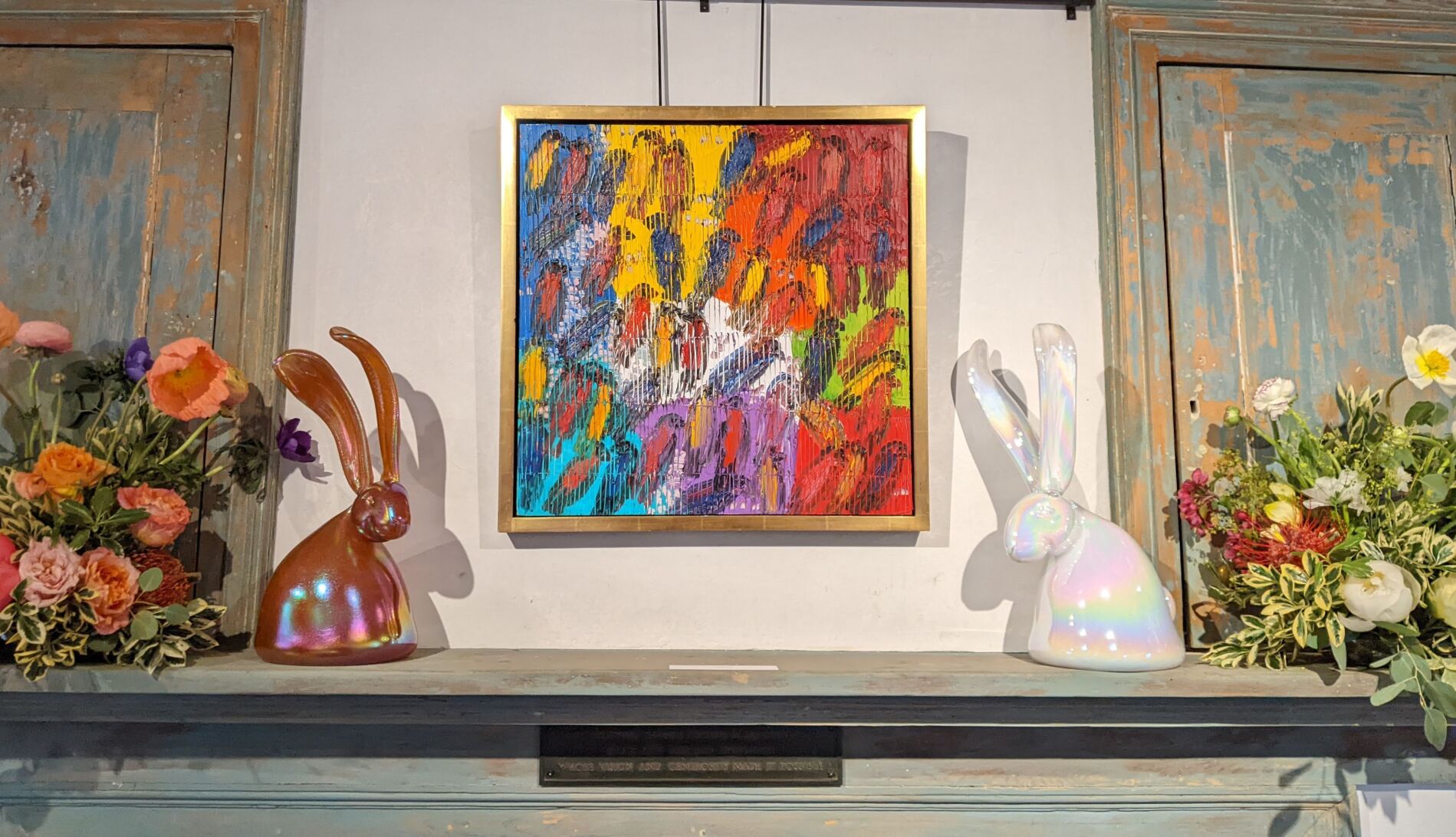 Two rabbits and painting above mural
